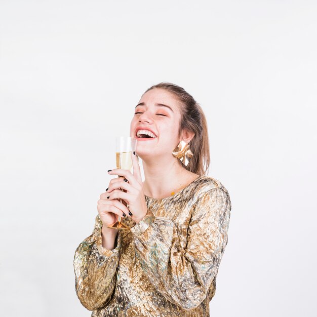 Happy woman enjoying glass of champagne