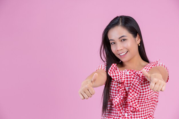 Happy woman giving thumbs up