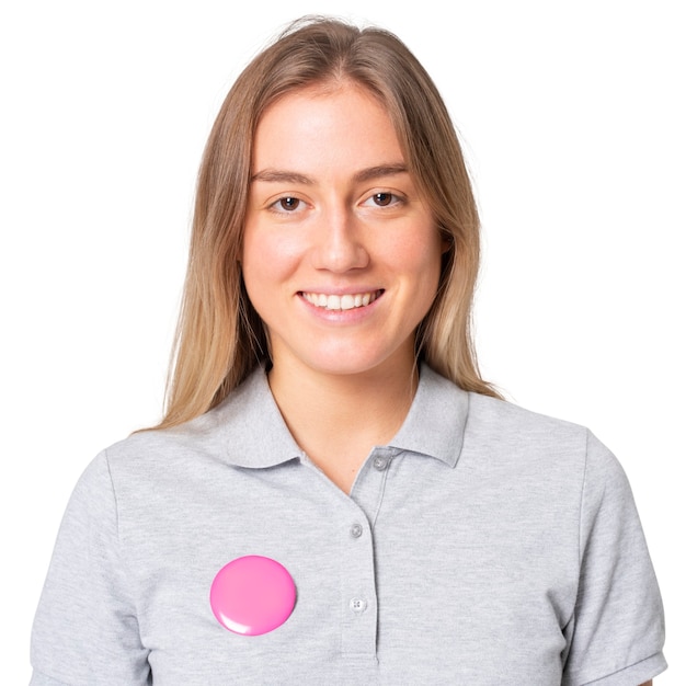 Free photo happy woman in gray polo shirt with pink pin button