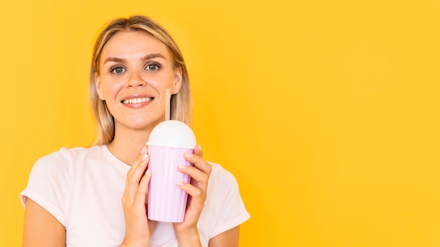 Happy woman holding drink