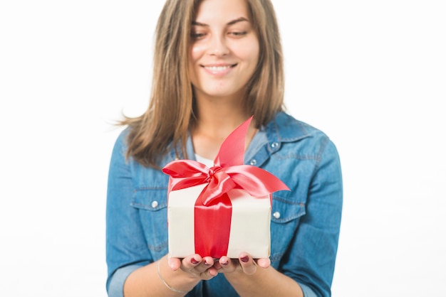 Free photo happy woman holding gift box
