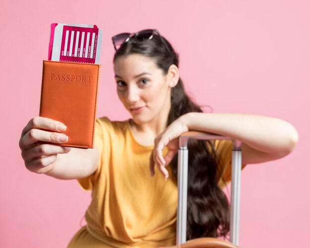 Happy woman holding her passport