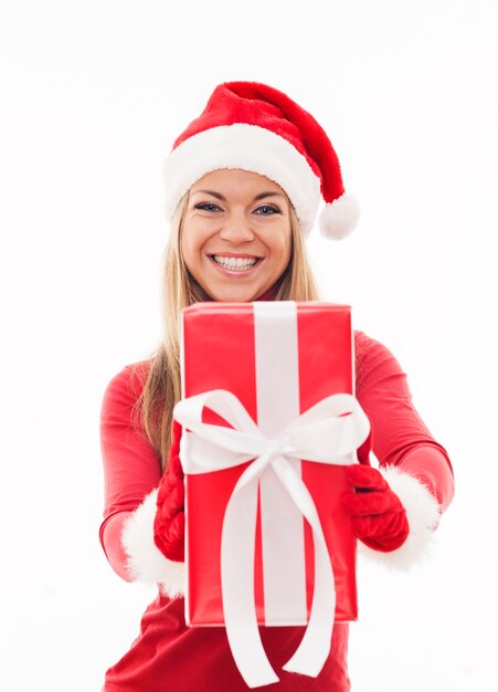 Happy woman holding red present