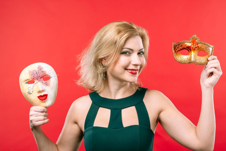Free Photo happy woman holding two masks in hands