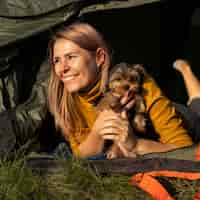 Free photo happy woman hugging her dog