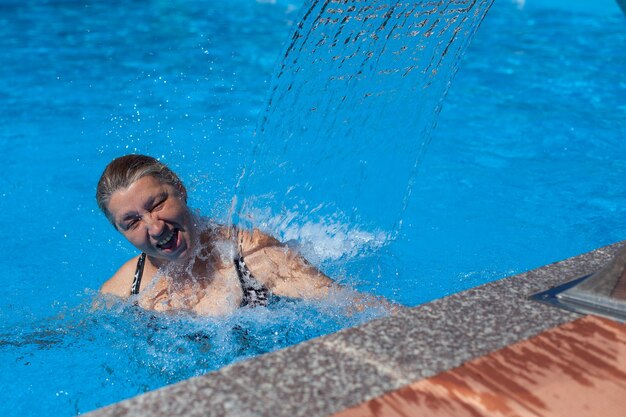 Happy woman is resting in summer at resort person is enjoying summer vacation at tropical resort and...