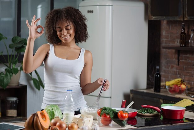 Happy woman in kitchen