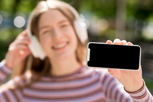 Happy woman listening to music