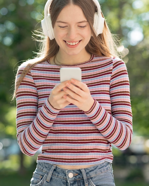 Free photo happy woman listening to music