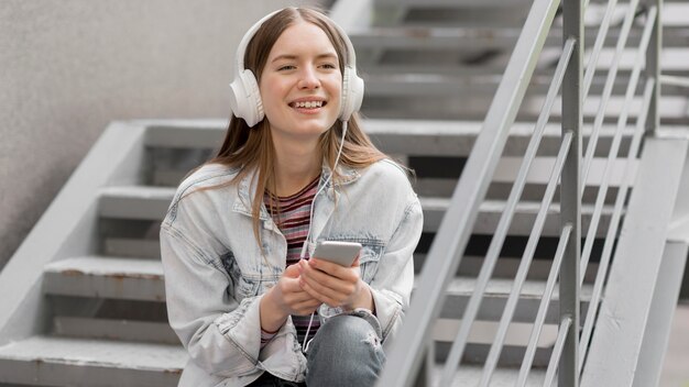 Happy woman listening to music