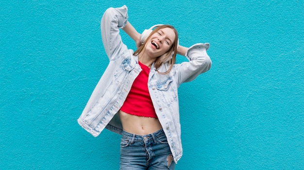 Free photo happy woman listening to music