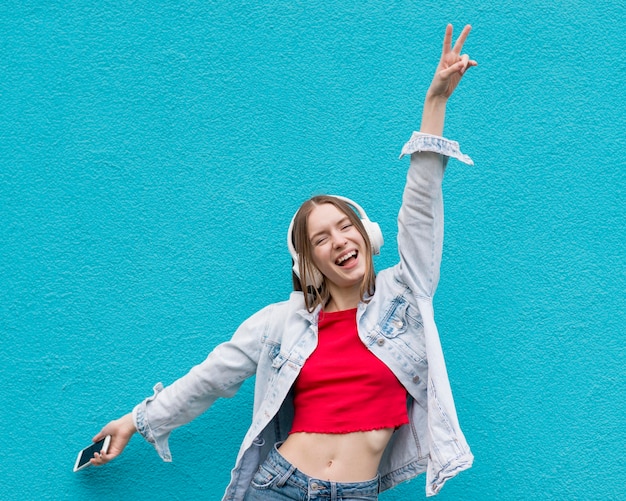 Happy woman listening to music