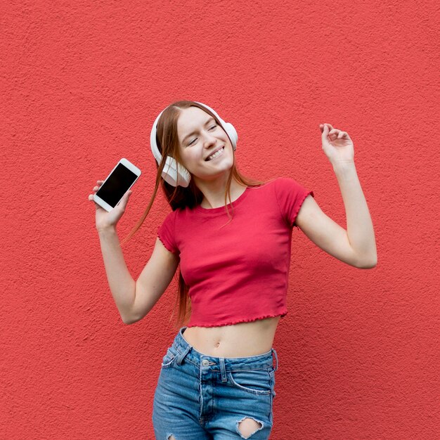 Happy woman listening to music