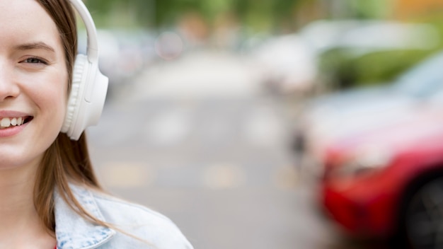 Free photo happy woman listening to music