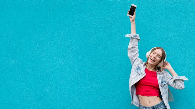 Happy woman listening to music