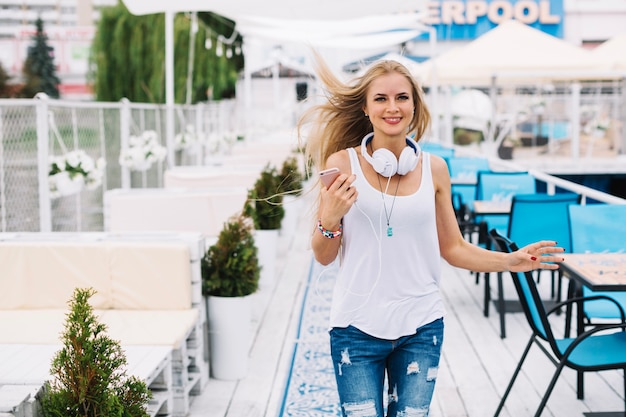 Happy woman near outdoor cafe