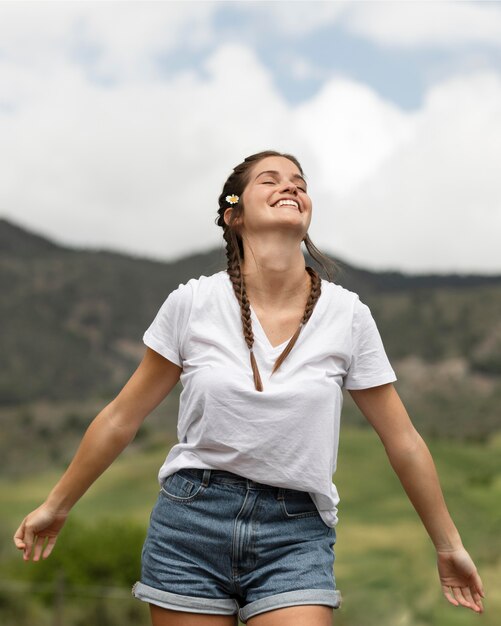 Happy woman outdoors medium shot