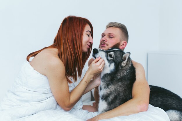 Happy woman petting her dog