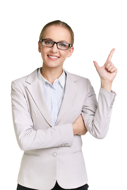 Happy woman pointing up with her finger