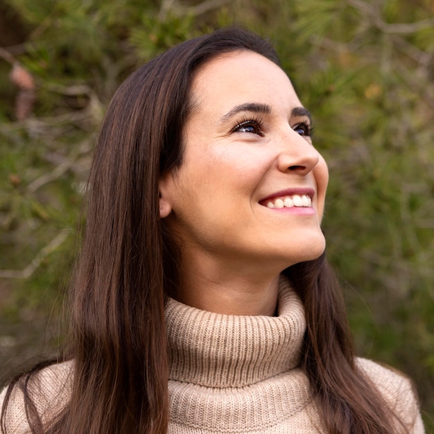 Happy woman posing outdoors in nature