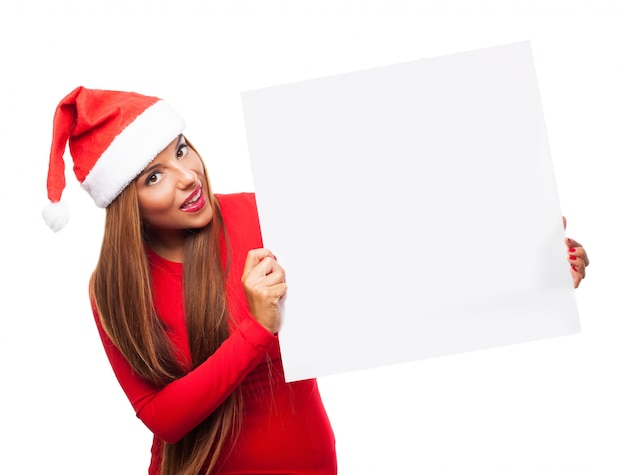 Happy woman posing with a blank sign