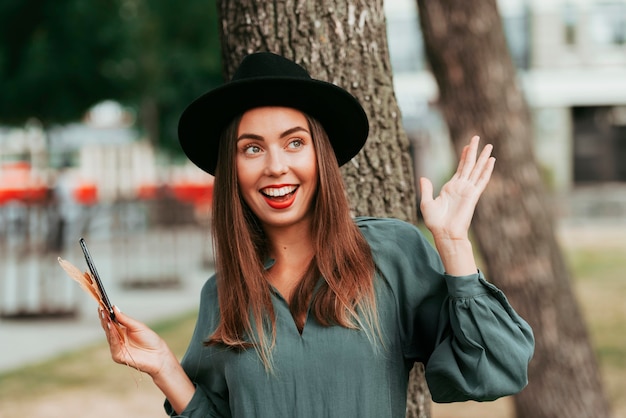 Happy woman posing with her hands up