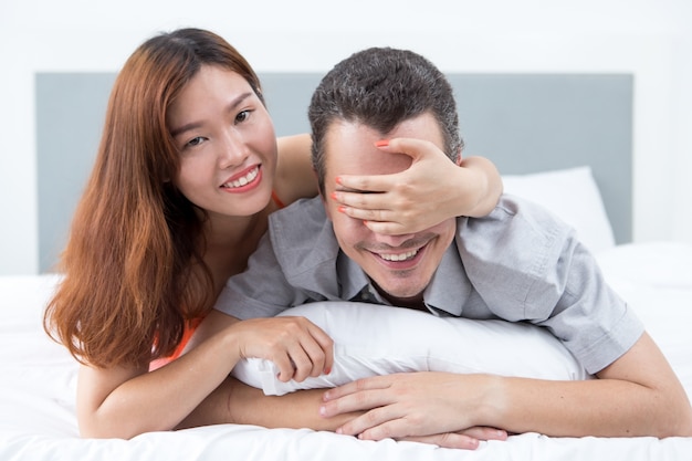 Happy Woman Preparing Surprise for Husband