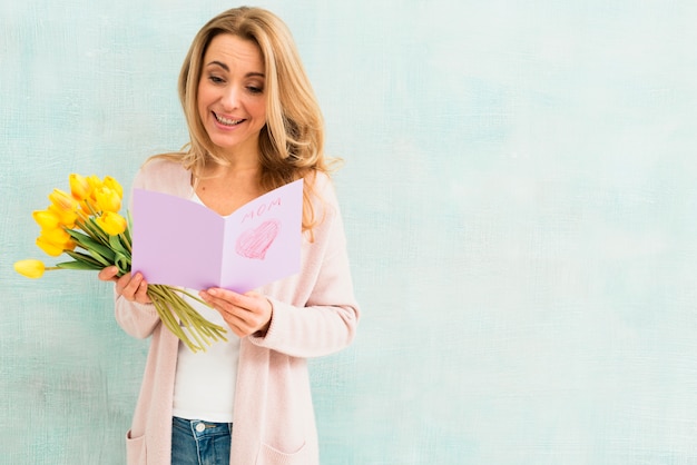 Happy Woman Reading Mother`s Day Postcard