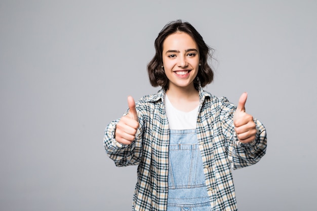 Happy woman showing thumb up. Looking