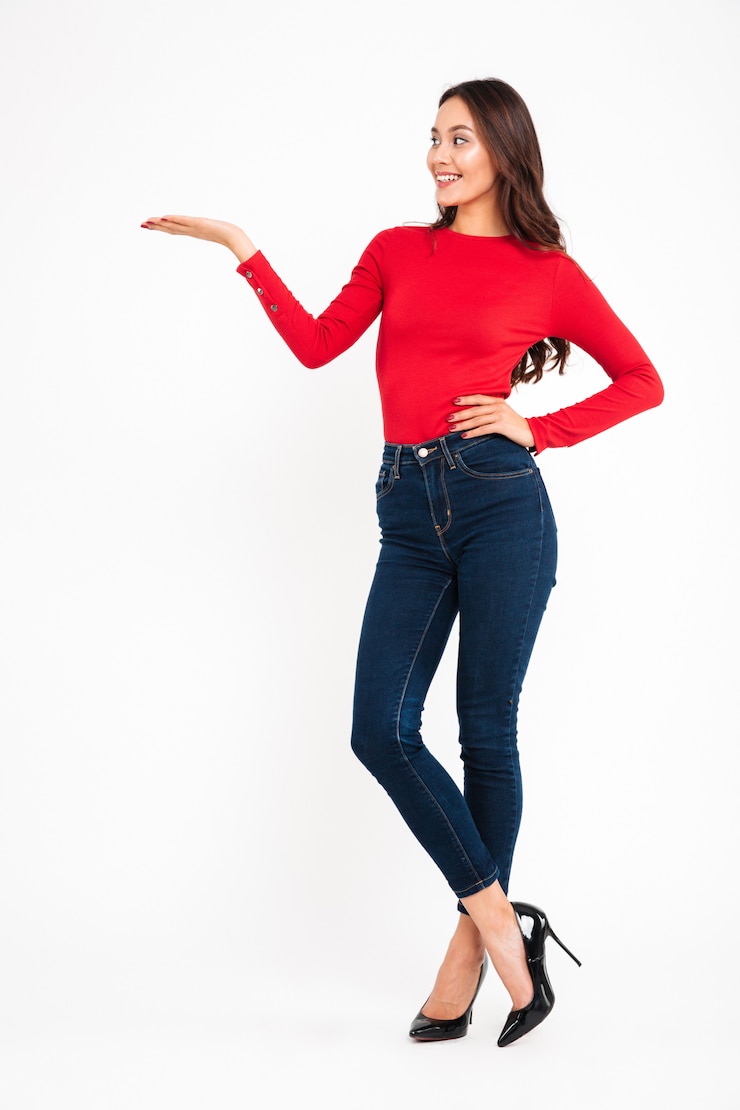 Free Photo happy woman standing isolated holding copyspace in hand.