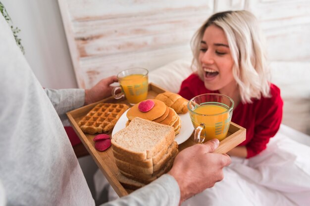 Happy woman surprised by boyfriend