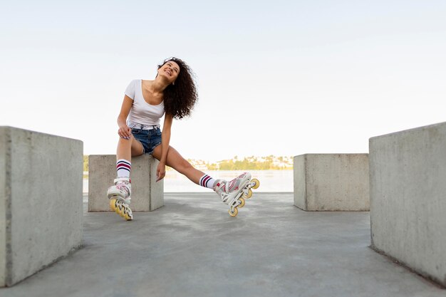 Happy woman wearing roller blades