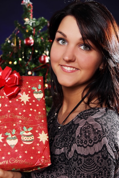 Happy woman with Christmas gift