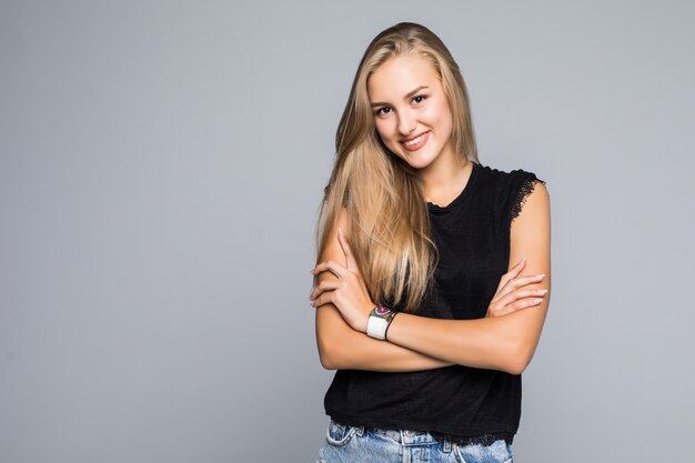 Happy woman with crossed arms on a white background