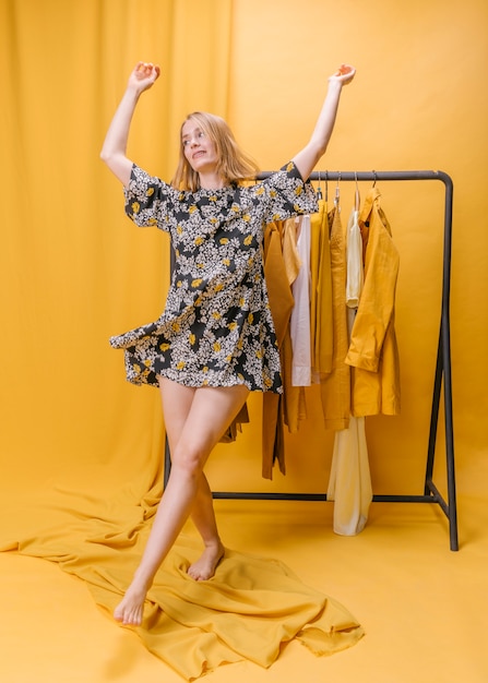 Happy woman with dress in yellow scene