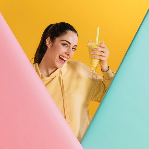 Happy woman with a glass of juice