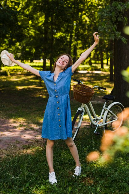 Happy woman with hands in air