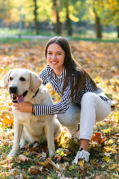 Happy woman with her cute dog