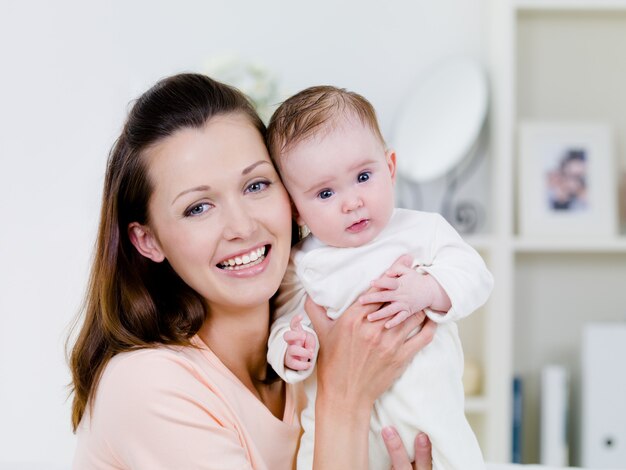 Happy woman with newborn child