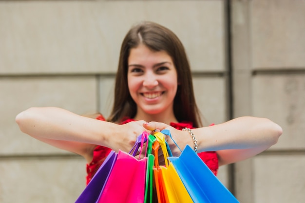 Free photo happy woman with shopping bags