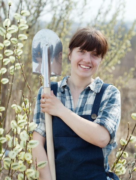 Free photo happy  woman   with shovel