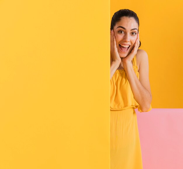 Happy woman in yellow dress