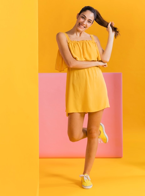 Happy woman in yellow dress