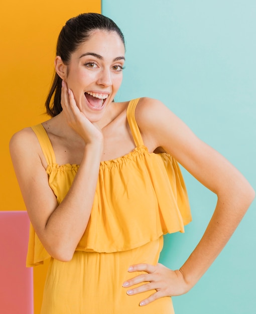 Happy woman in yellow dress