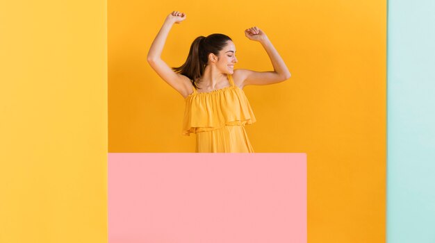 Happy woman in yellow dress