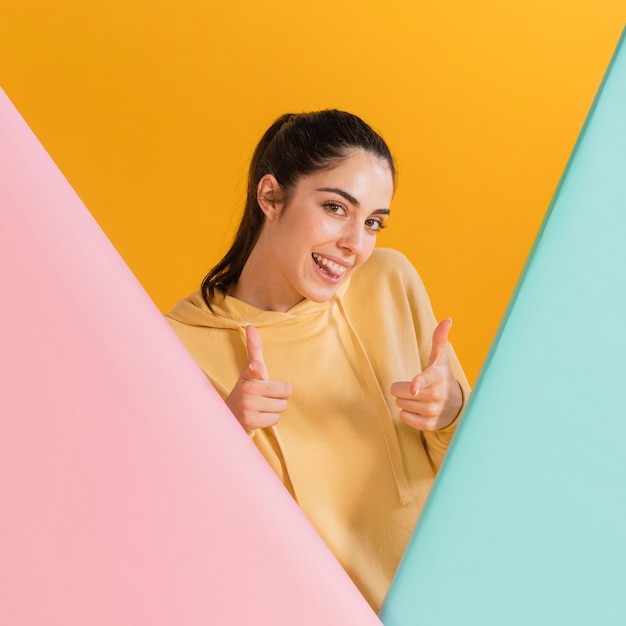 Free photo happy woman in a yellow sweater