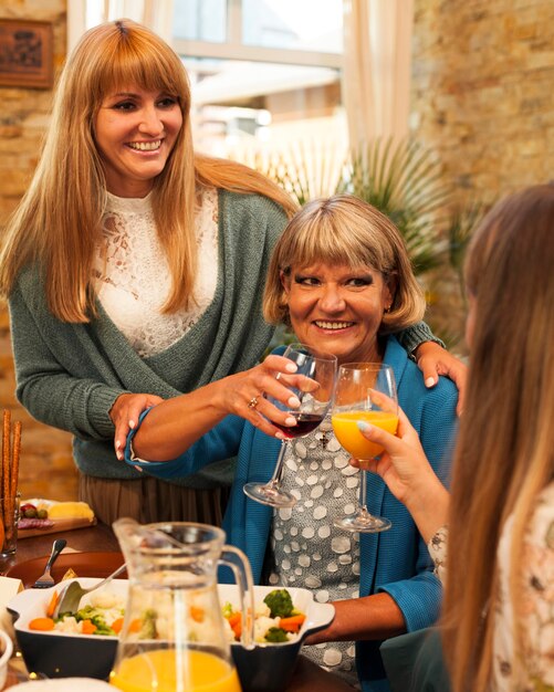 happy women at dinner table