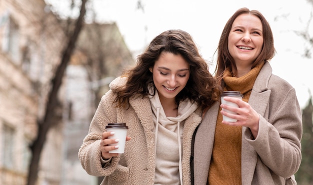 Happy women walking outdoors