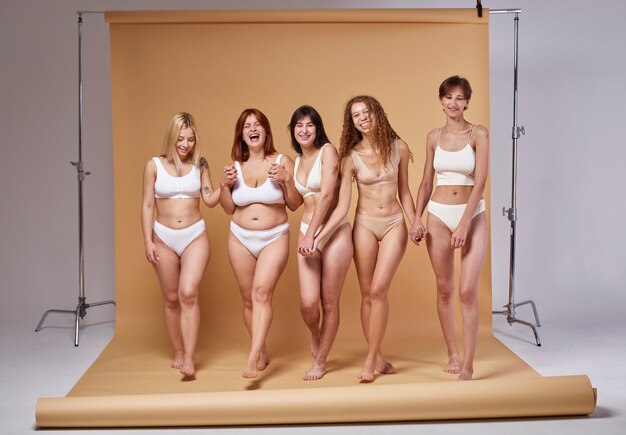 Happy women with different bodies full shot