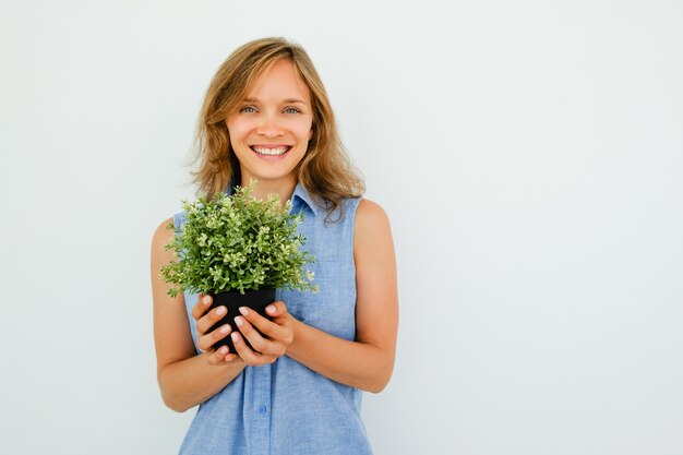 Happy Young Beautiful Woman Holding Pot Plant